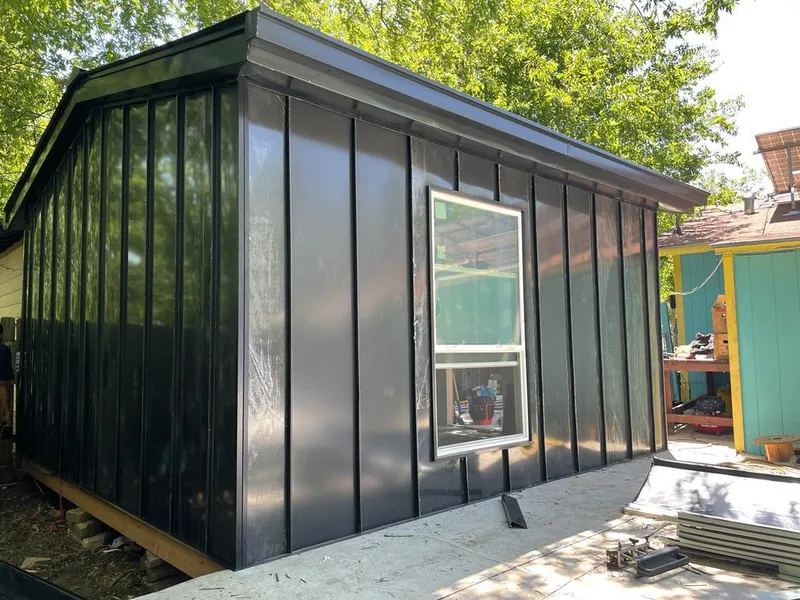 Black standing seam metal wall panels for Metal Roof Installation in Stafford